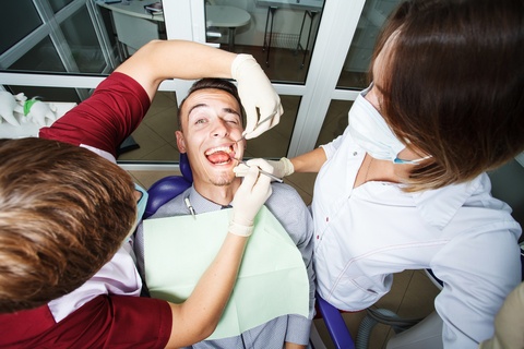 Dentist in Fayetteville NC Examining a Patient's Teeth