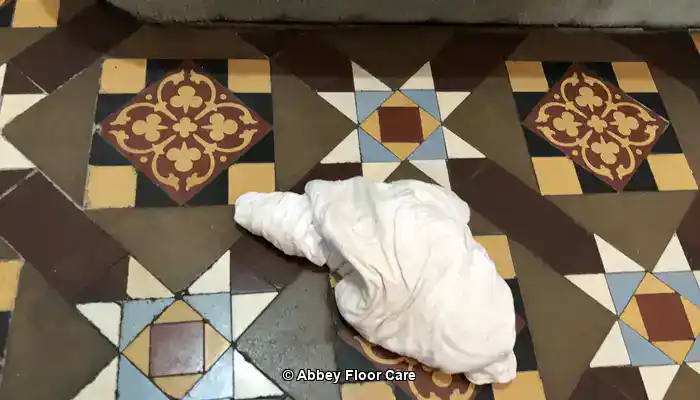 Abbey Floor Care restoring the colour to a Victorian clay tile floor using a colour enhancing impregnating sealer
